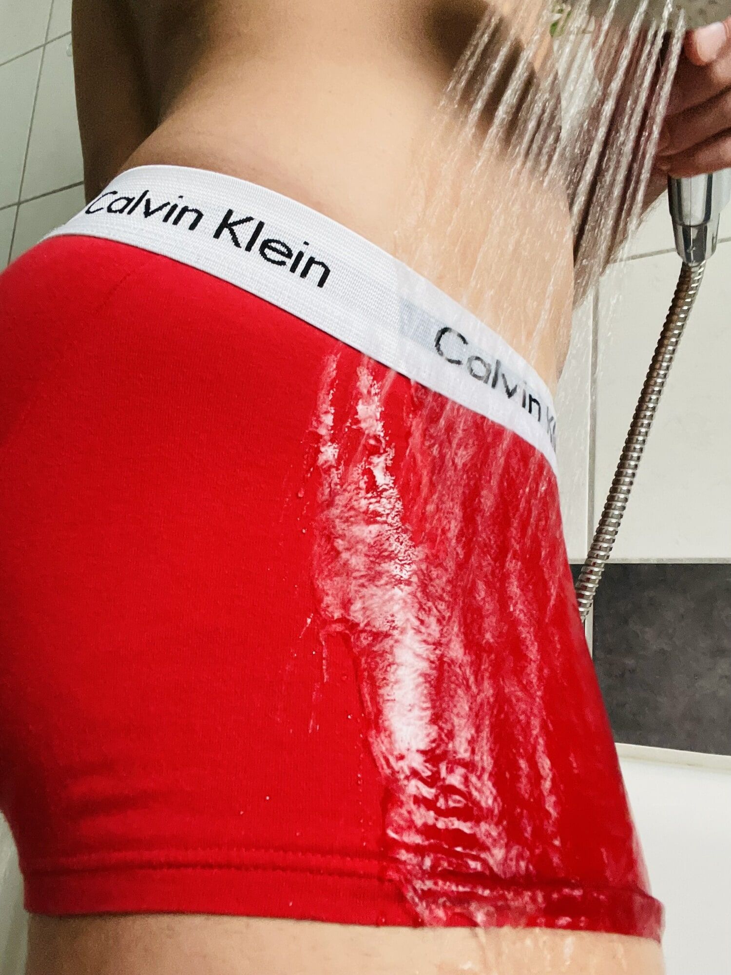 Wet Calvin Klein briefs