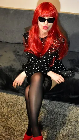 redhead wife with black stockings and red high heels         