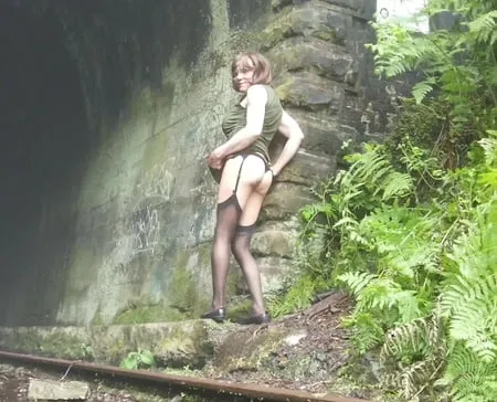 road trip to old train tunnel green dress         