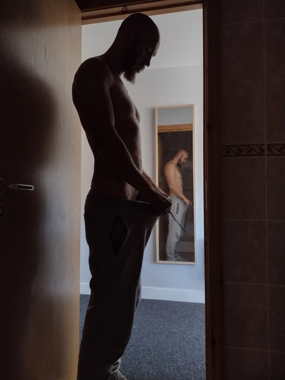 Posing nude in doorway #4