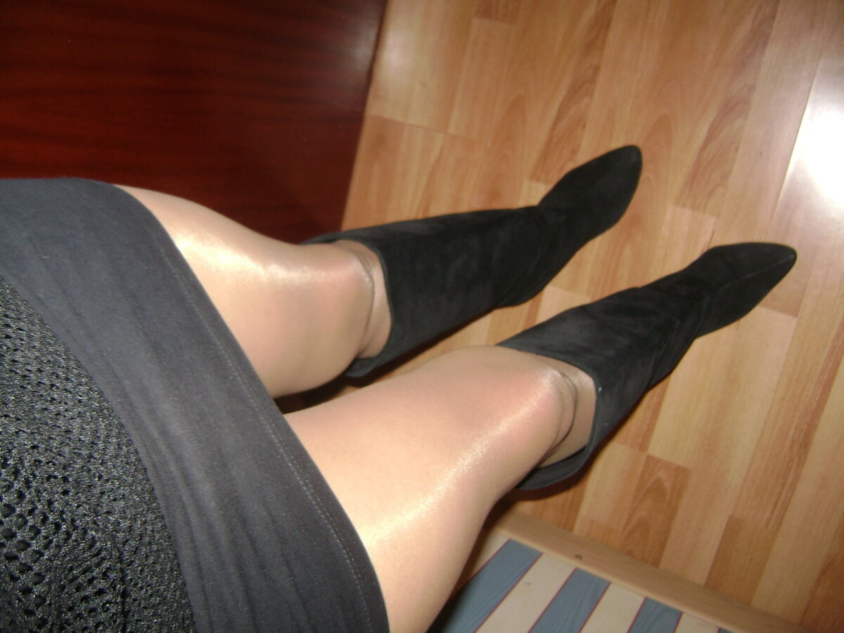 in a mini dress with garter stockings and lots of heels