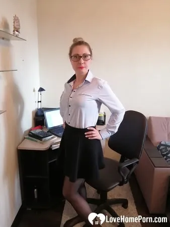 office worker in black stockings shows her goods         