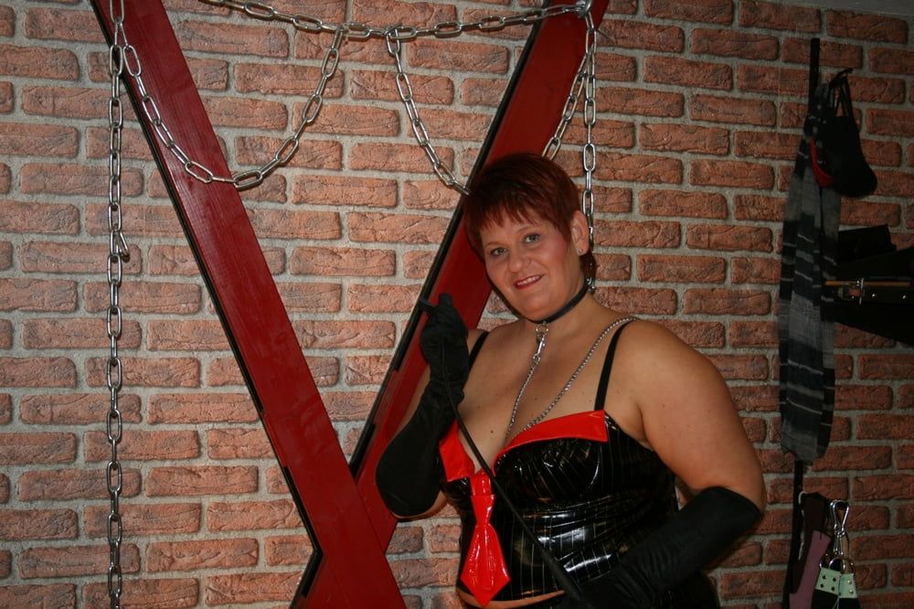 In latex paint outfit on the cross #16