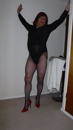 SISSY ROSIE IN FISHNET, RED HEELS AND BODYSUIT