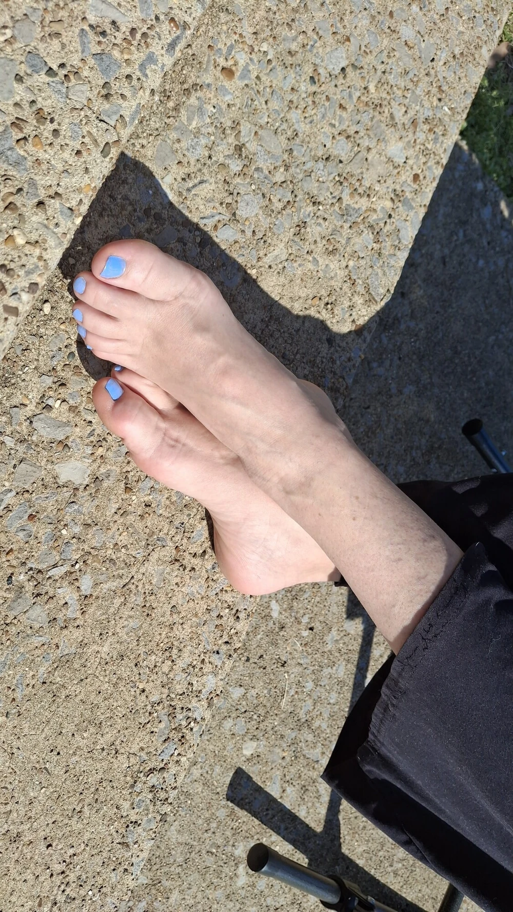 Relaxing outside showing our pedicured and painted toes #12