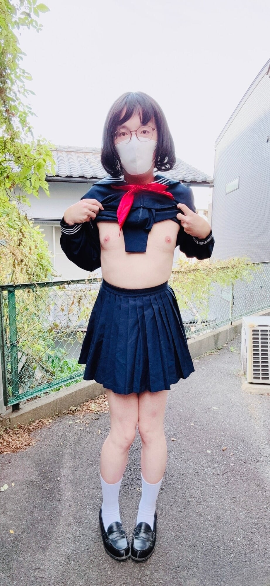 A trans woman in a swimsuit under sailor uniform outside  #16