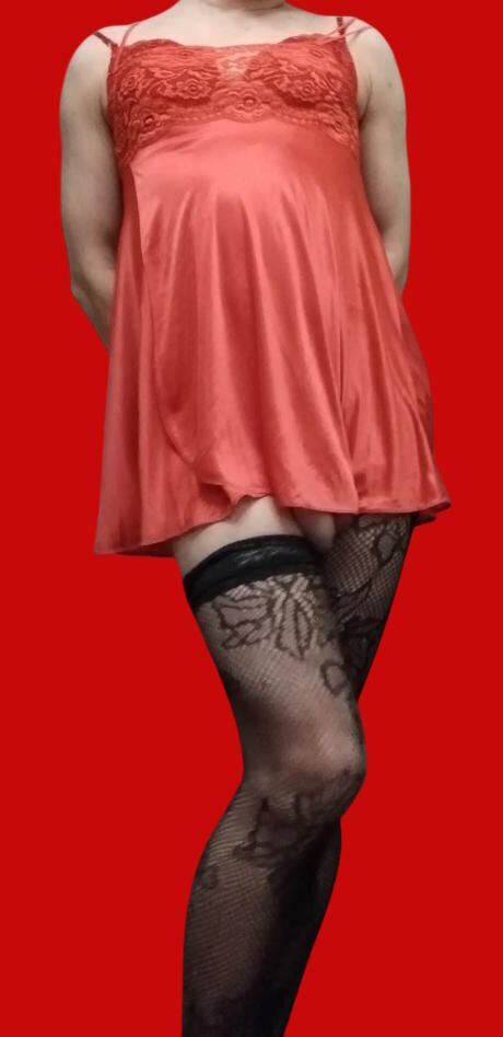 Crossdresser posing in red sexy lingerie with chooks