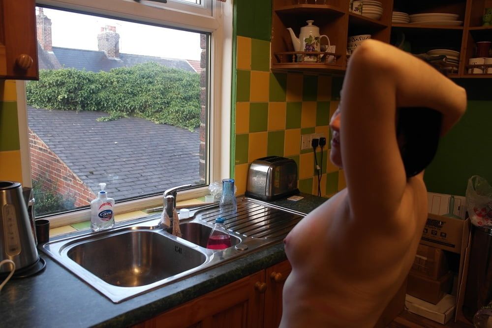 posing nude in window #25