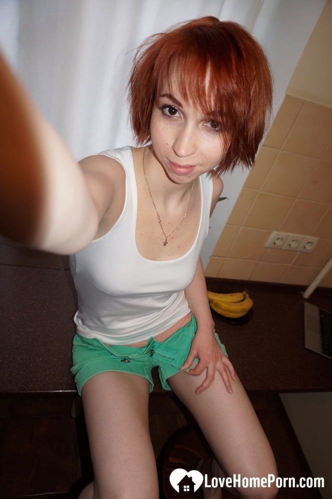 Beautiful redhead knows how to highlight her goods #10