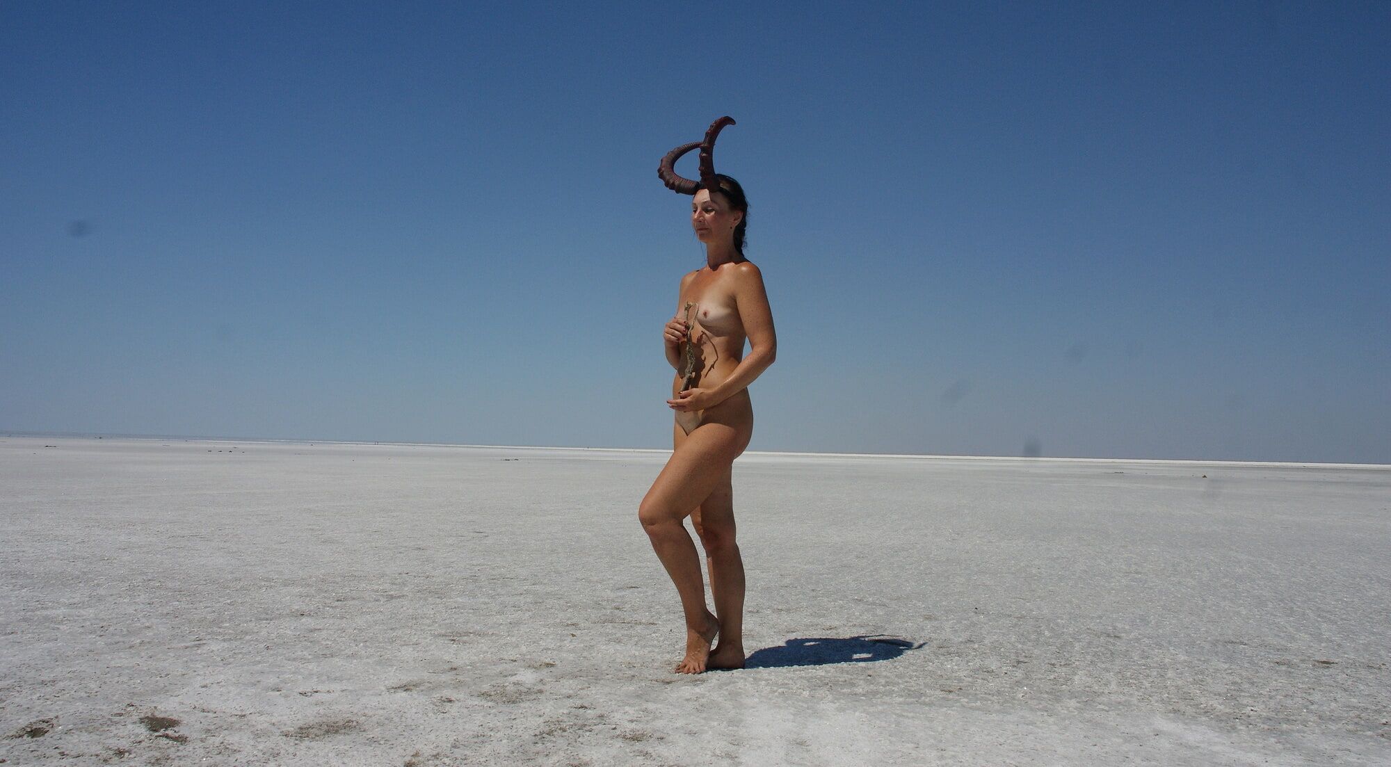 Standing naked on the salt of the salt lake Elton #33