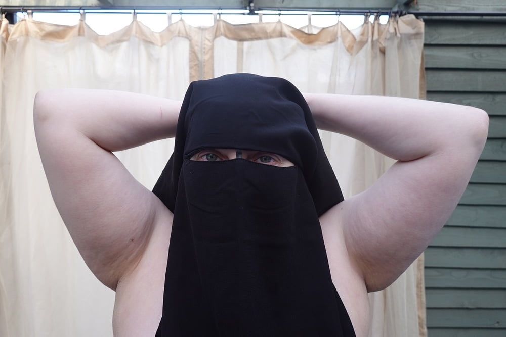 Nude in Niqab in ankle boots