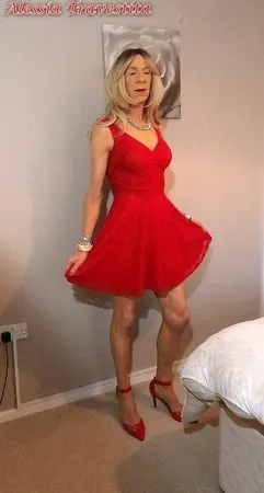    alessia travestita in flirty red dress         