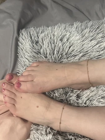 Wife showing off her pedicure with her anklets on her foot