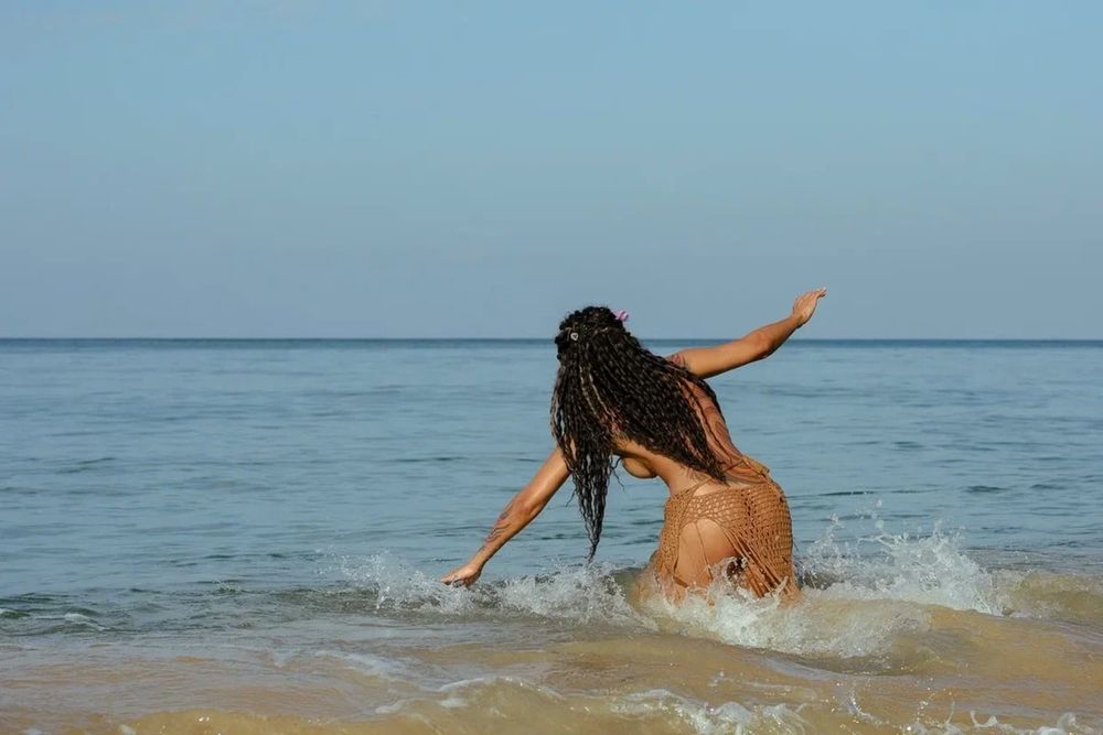 Beautiful view. A gorgeous brunette. Want to swim with me?