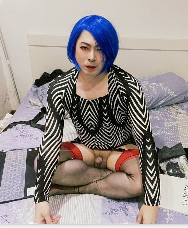 In blue wig and black stockings