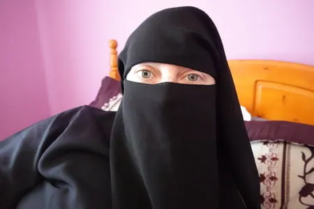 burqa and heels on the bed         