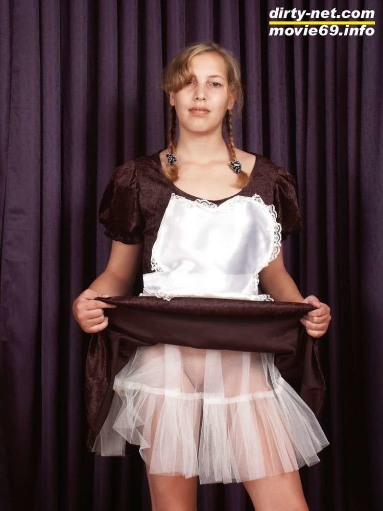 Teen Nathalie poses as a maid and strips