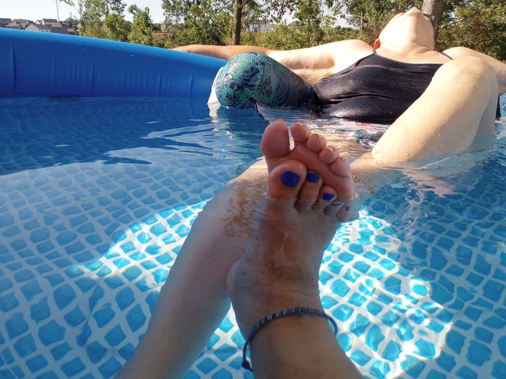 Showing off our pedicures in the pool #21