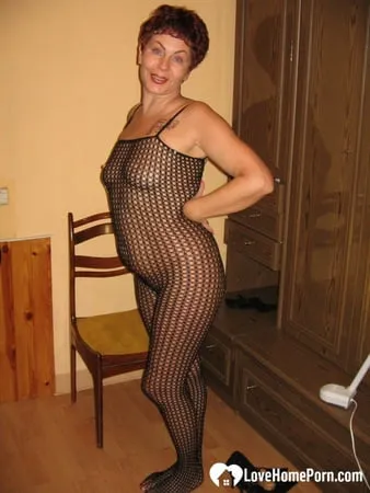 milf in a fishnet masturbates with a whip         