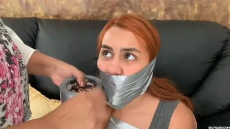 hogtaped student lectured with foot whipping in tape bondage         