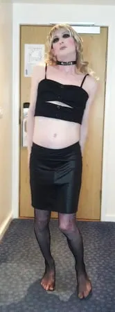 sissy crossdresser in black slut outfit posing         