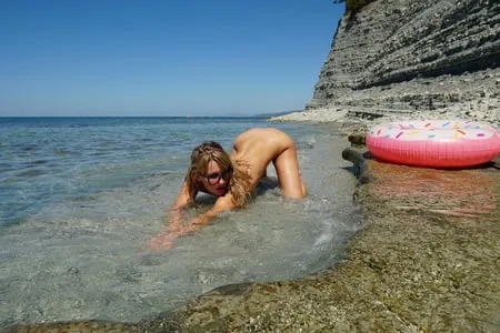 kinky nudist girl in the public beach         