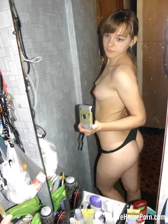 hot teen taking some selfies at home         