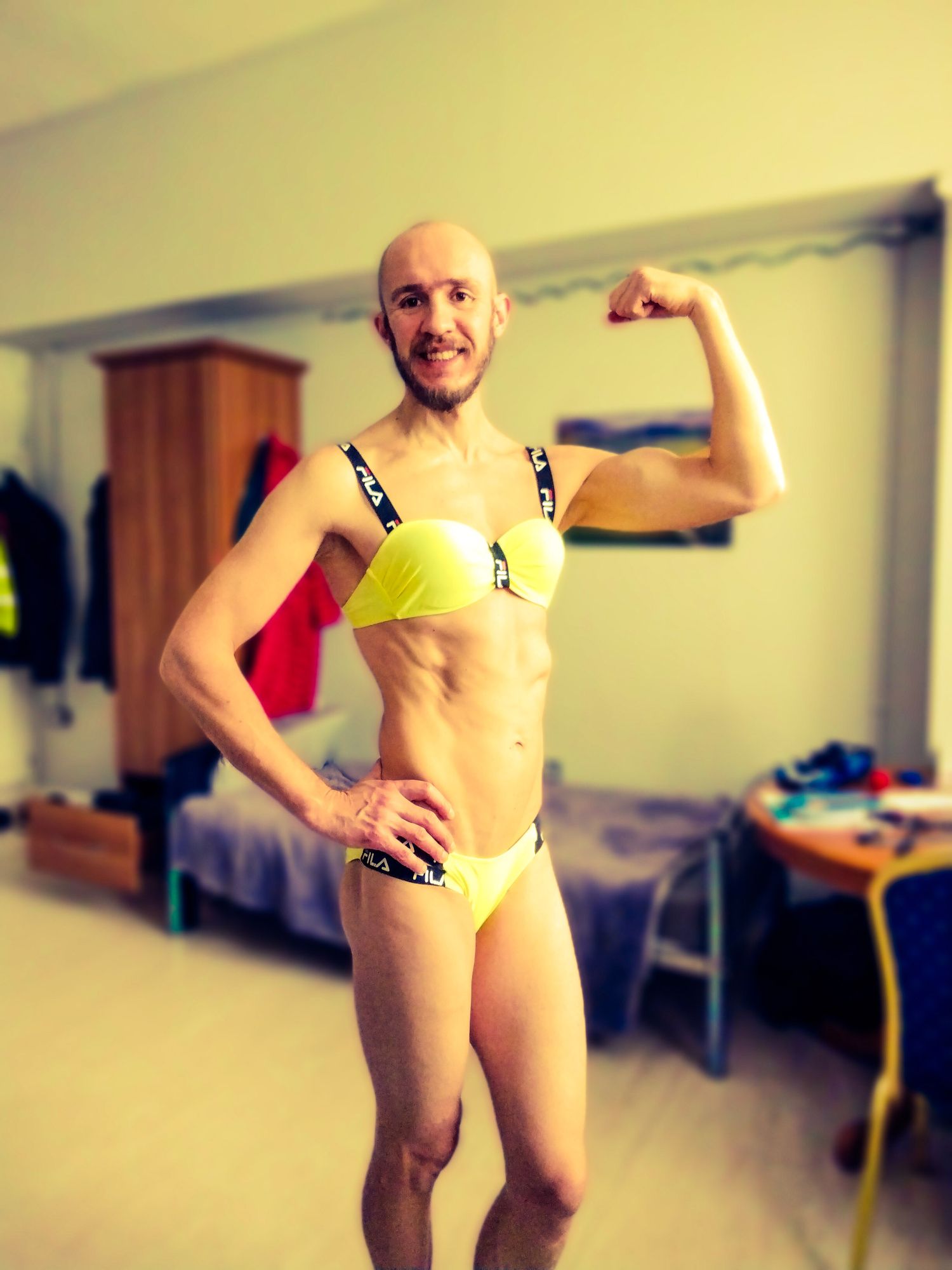 Bearded athletic man posing in yellow swimsuit  #3