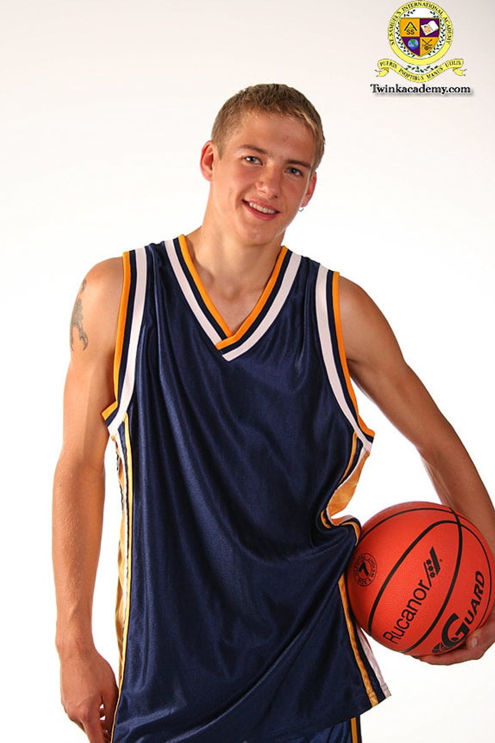 Blond teenage Latvian hunk poses in his basketball uniform