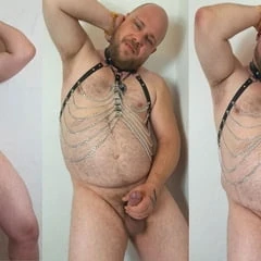 Pierced and tattooed gay man shows himself naked with bush