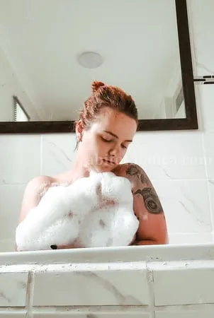 abitofbianca hot tattooed redhead playing in a bubble bath         