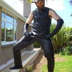Leather Master outdoors posing in full leather