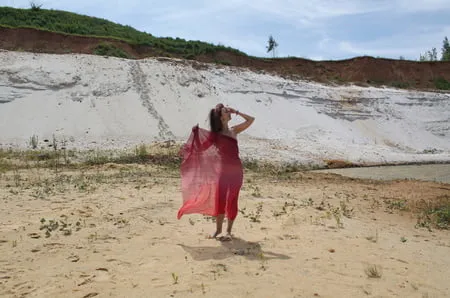 red shawl on white sand         