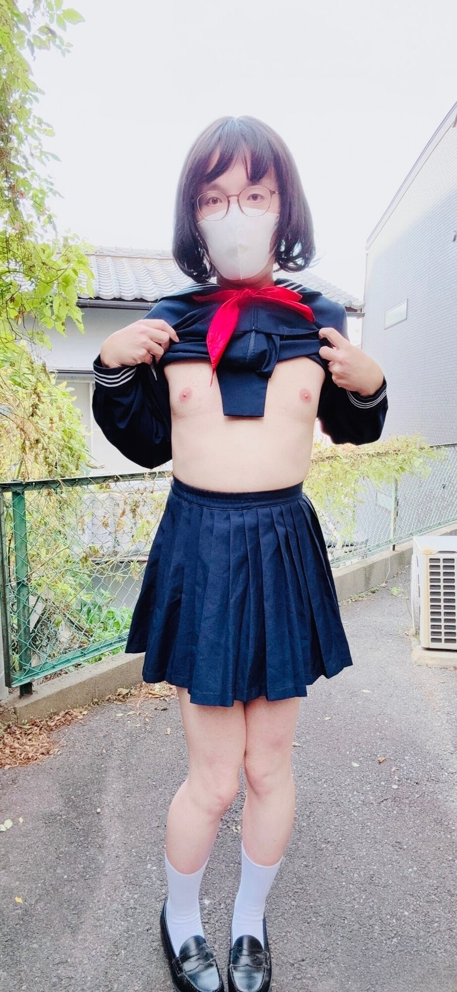 A trans woman in a swimsuit under sailor uniform outside  #14