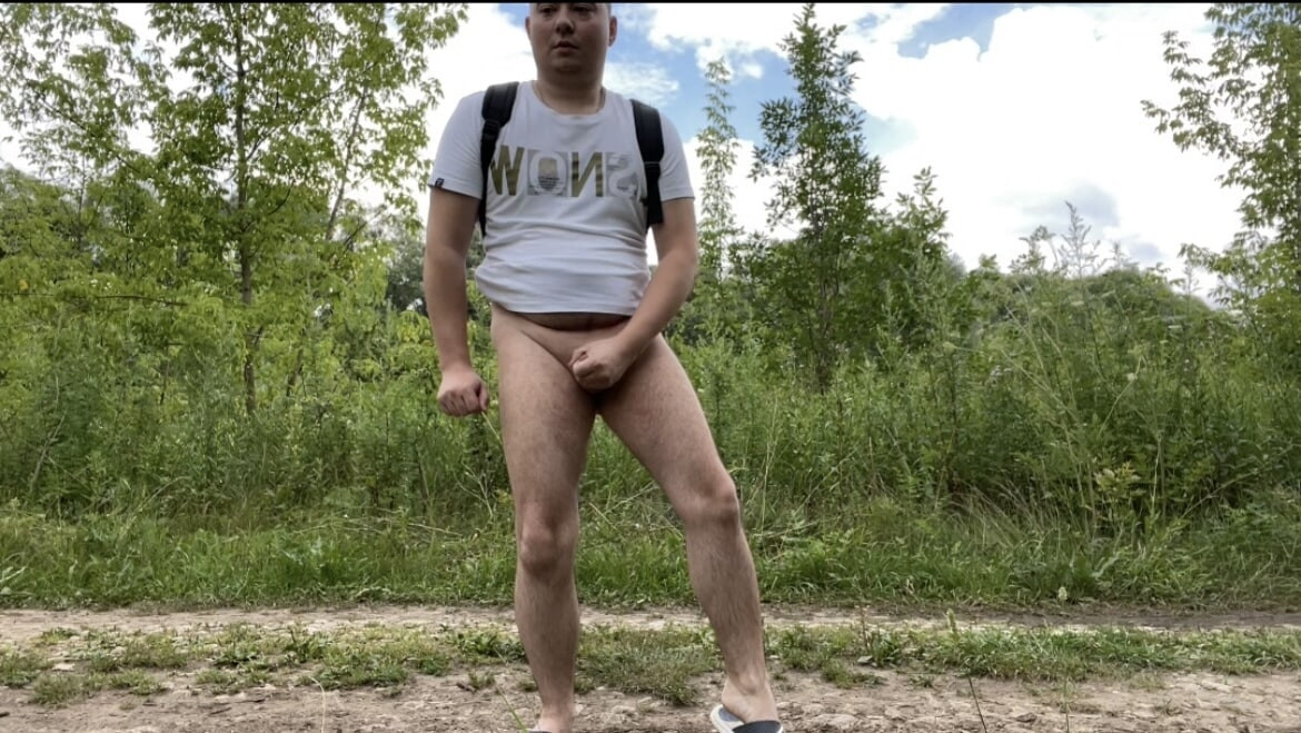 A photo of a naked walk in the summer forest #10