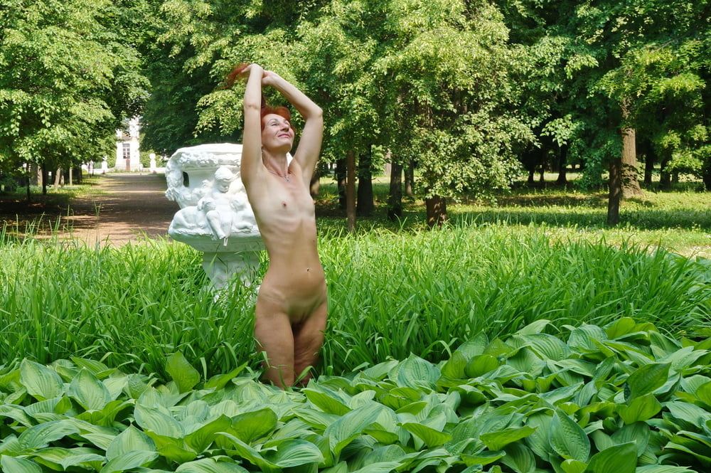 Naked in the grass by the vase #10