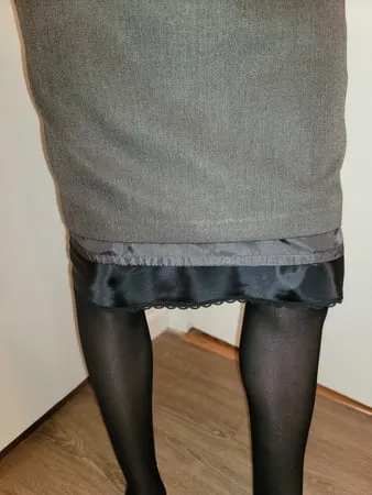 grey pencil skirt with black silky half slip         