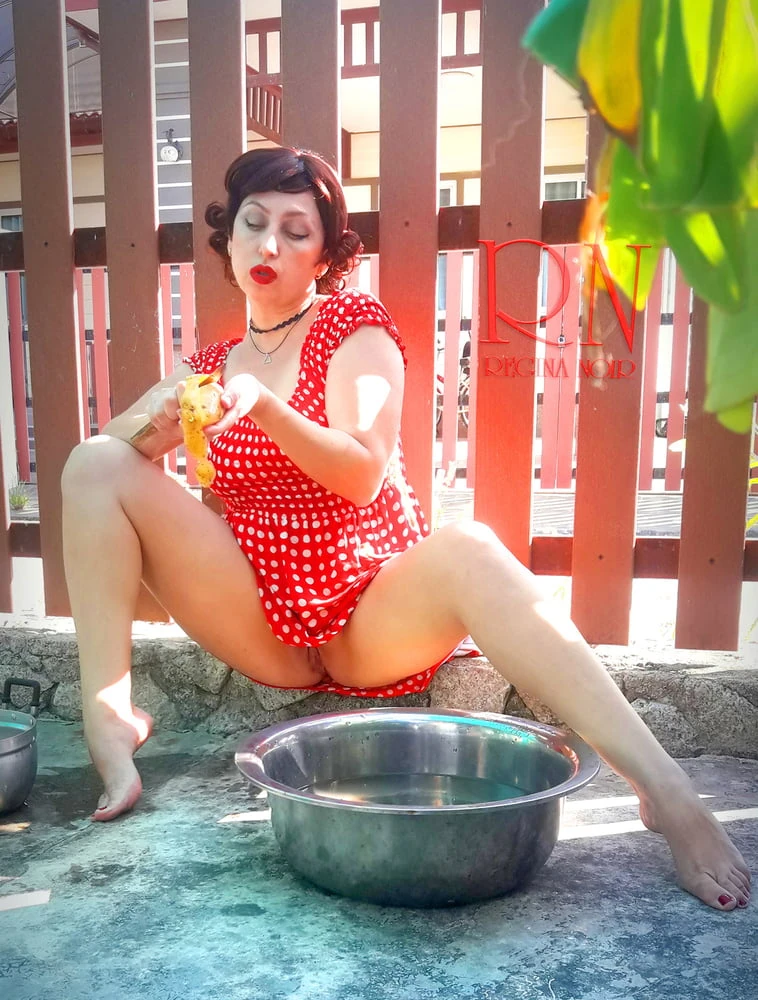 Retro maid prepares potatoes for dinner. Vintage performance #29