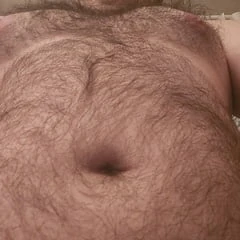 Just a hairy boy with a nice set of suckable boobs