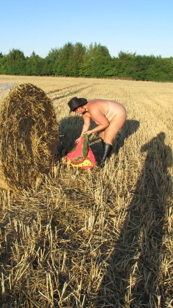 Anna naked on straw bales ...