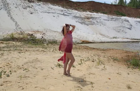 red shawl on white sand         