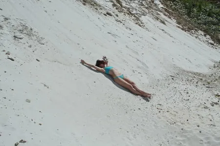 on white sand in turquos bikini         