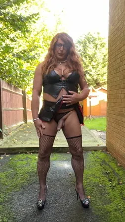 crossdresser kellycd     in pvc mini skirt and top stockings         