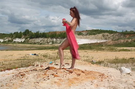 red shawl on white sand         