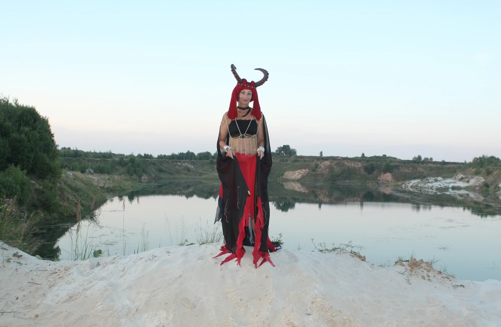 Witch over lake on sunset