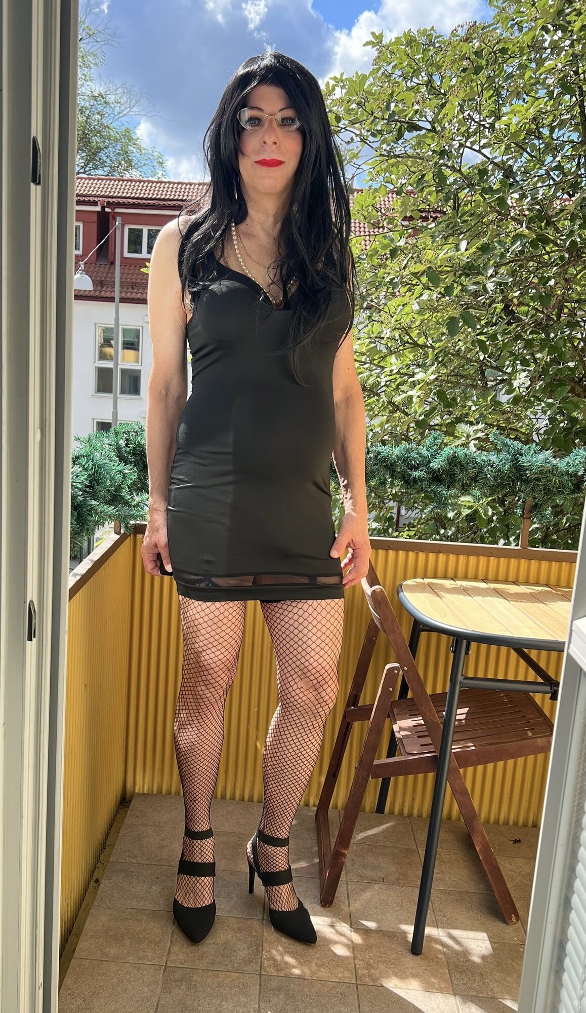 Busty sissy on the balcony #6