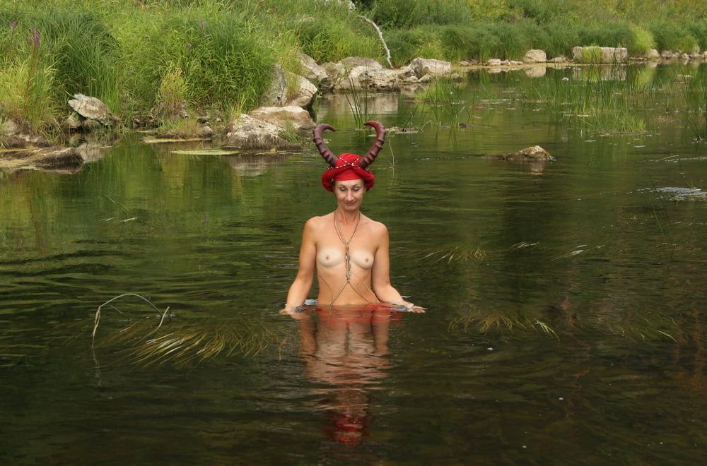 With Horns In Red Dress In Shallow River #49