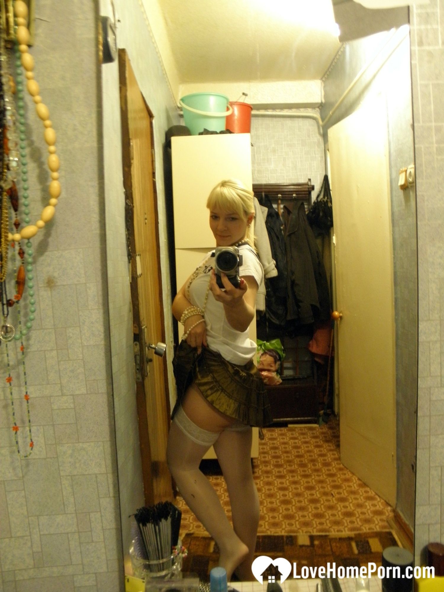 Aroused blonde in stockings taking naughty selfies #6