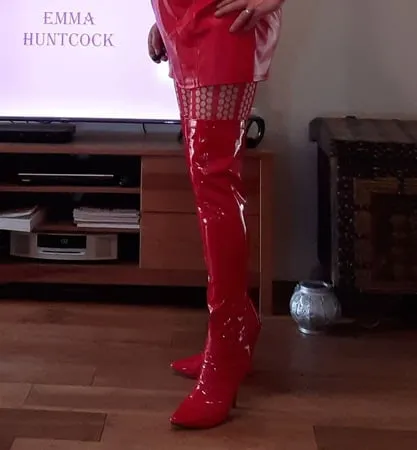 sissy in red lingerie and thigh boots         