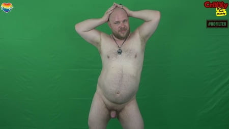 Gay pierced, unshaven bear shows himself naked